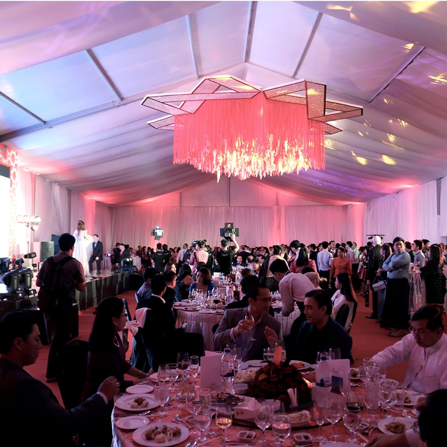 The Grand Gala Reception in a tented ballroom, Infinity chandelier as centrepiece