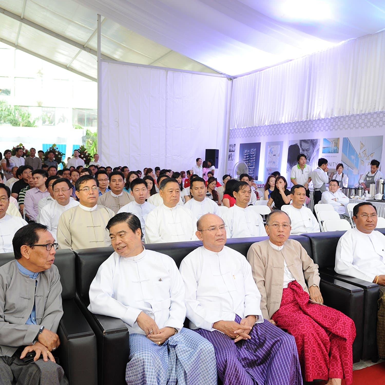 VIP guests at the launch ceremony, Infinity exhibition panels alongside