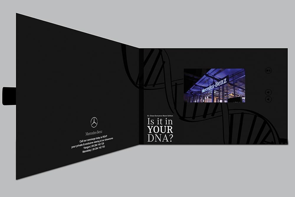 Video-brochure invitation with embedded screen playing the launch film — 'Is it in YOUR DNA?'