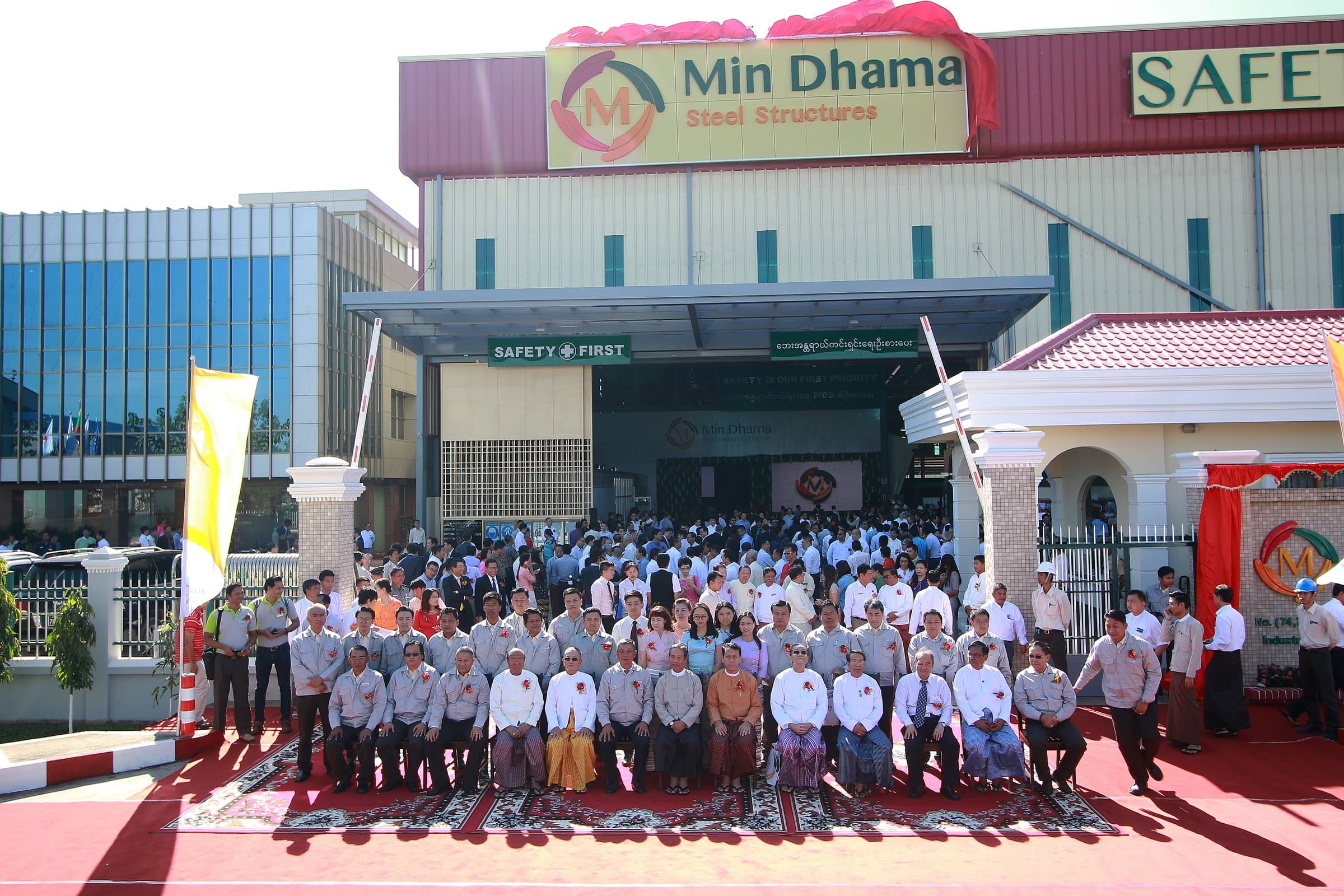 The Min Dhama team outside the completed factory