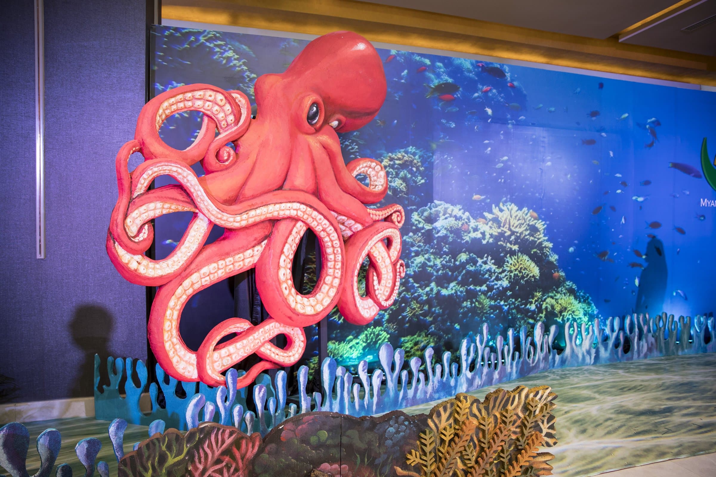 'M World' — the sculpted aquarium wall at the entrance