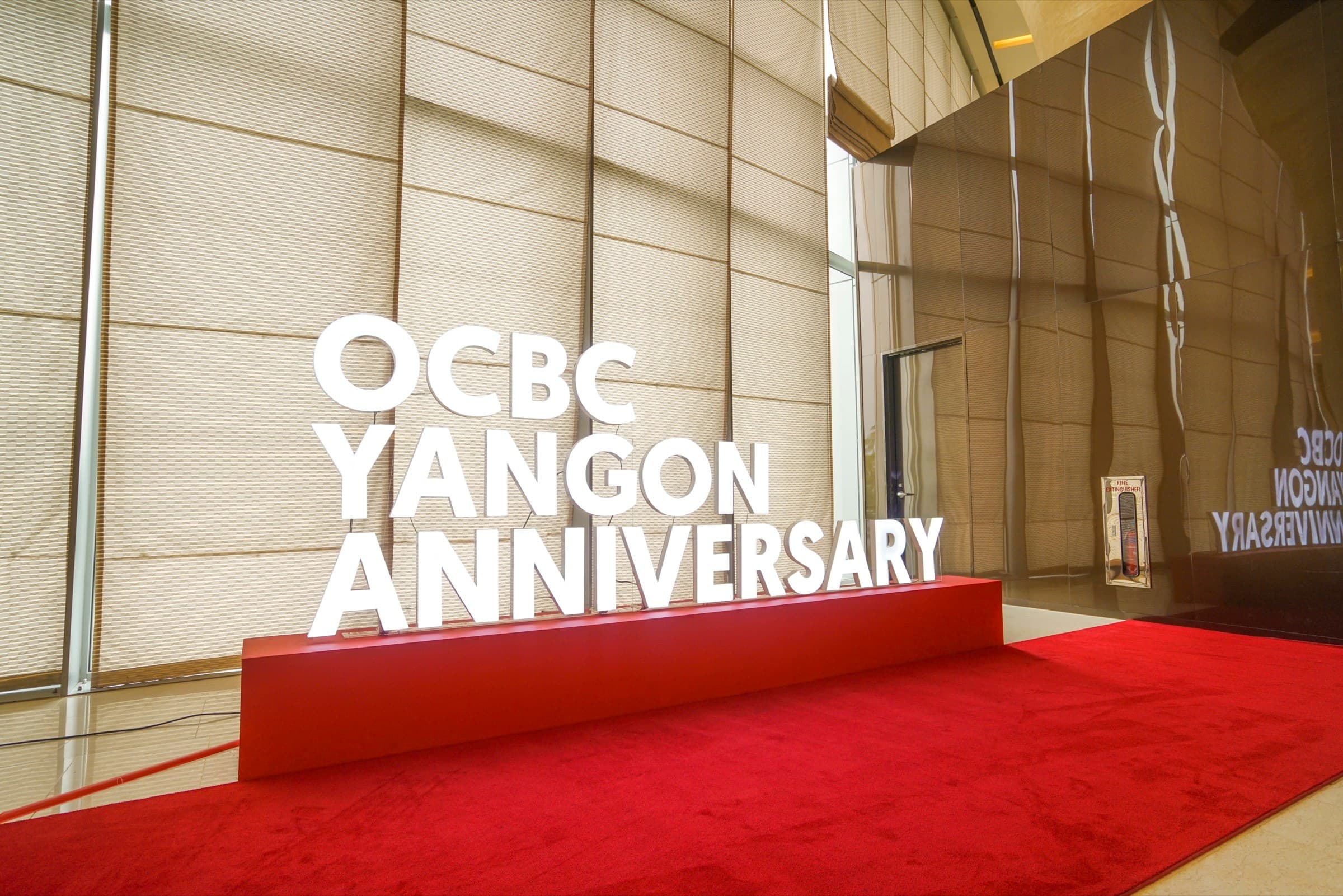 OCBC Yangon anniversary — dimensional lettering on the red carpet