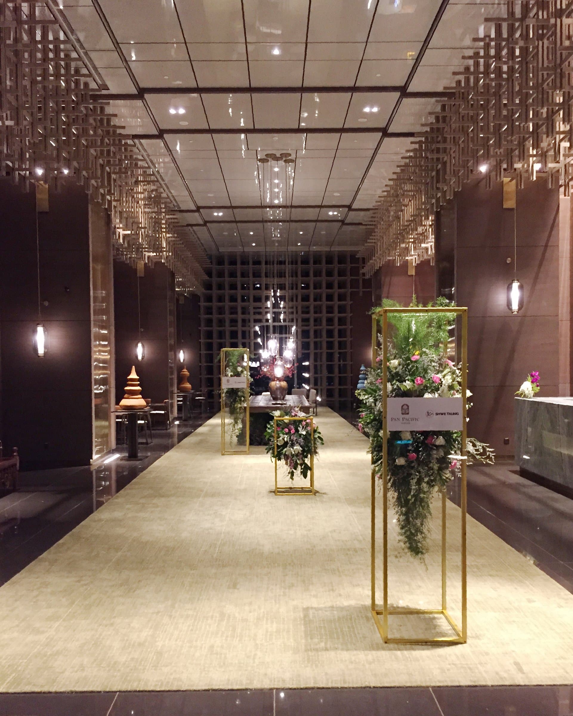 The arrival corridor lined with gold flower towers