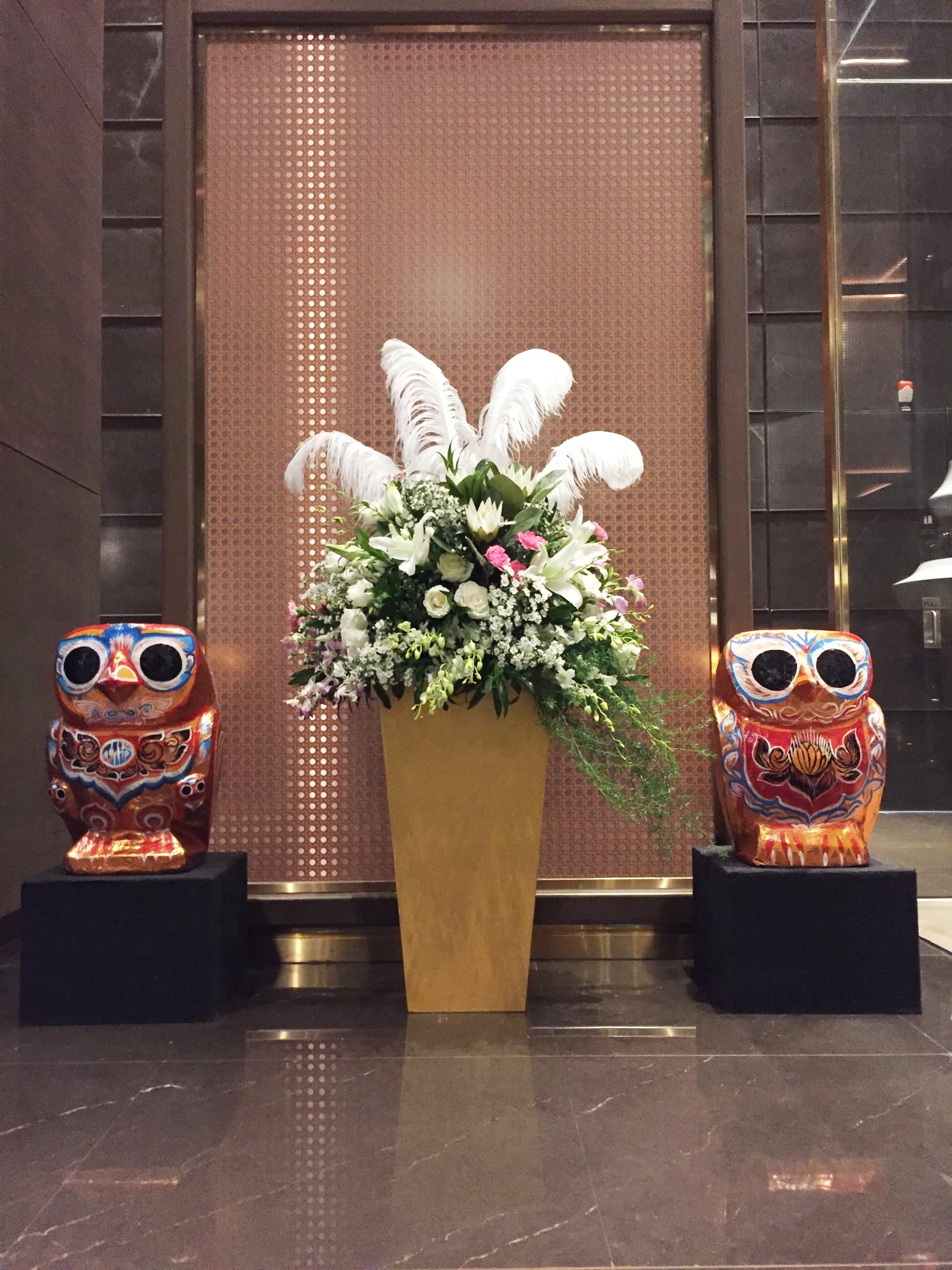 Guardian owls flanking the welcome arrangement