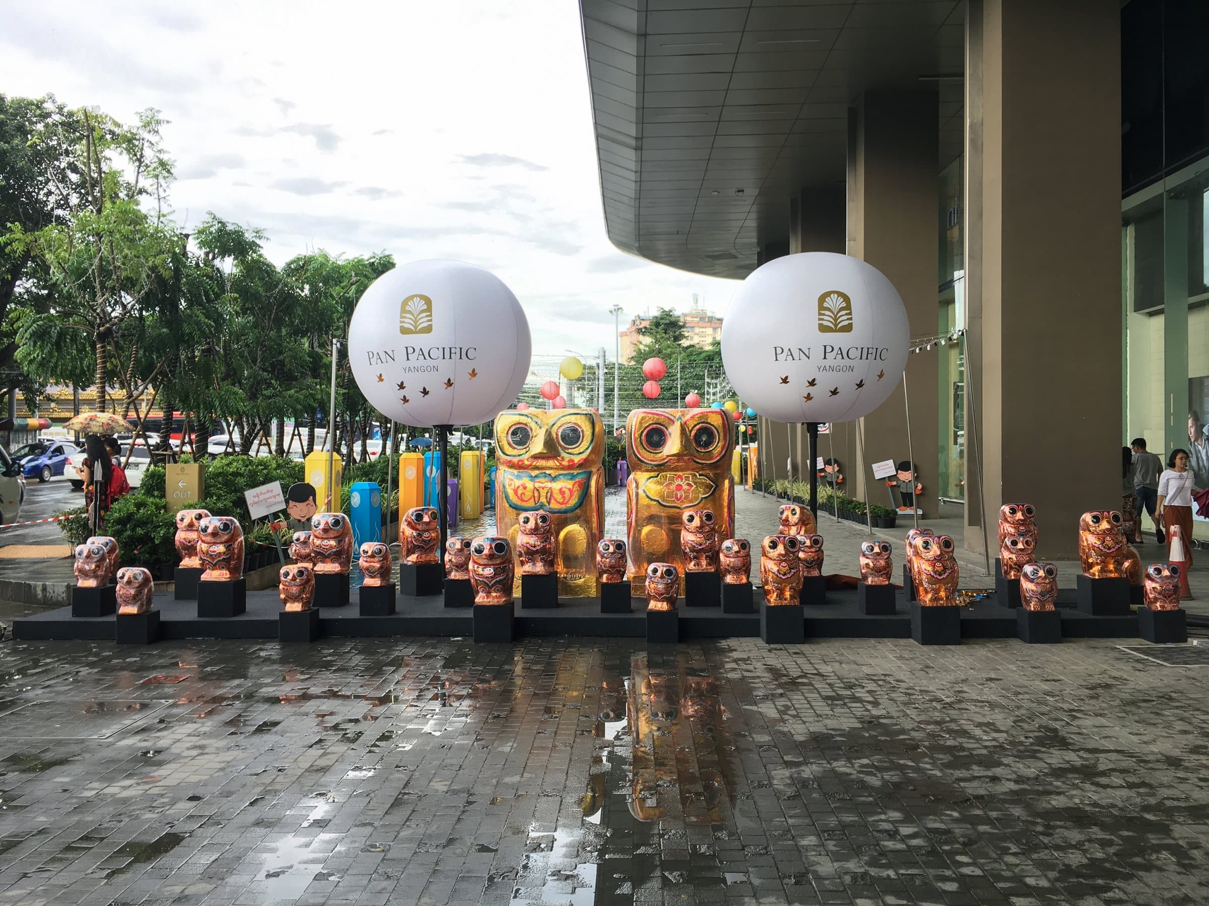 The owl family under Pan Pacific balloons at the entrance