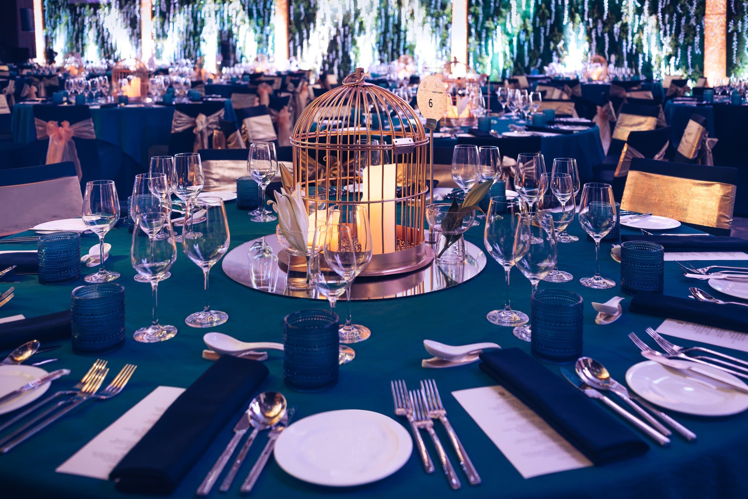Gala table setting — birdcage centrepiece on teal