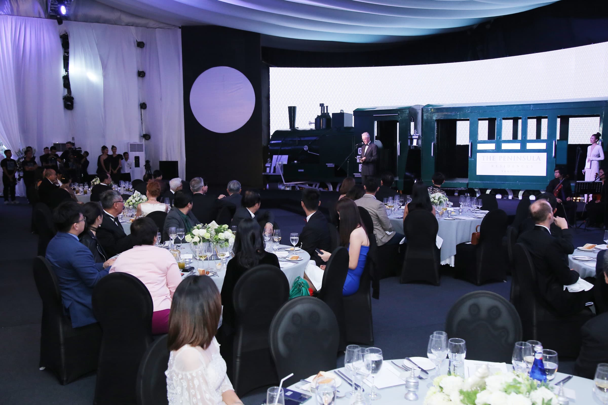 The Peninsula Residences gala — the ballroom with the life-size train set piece