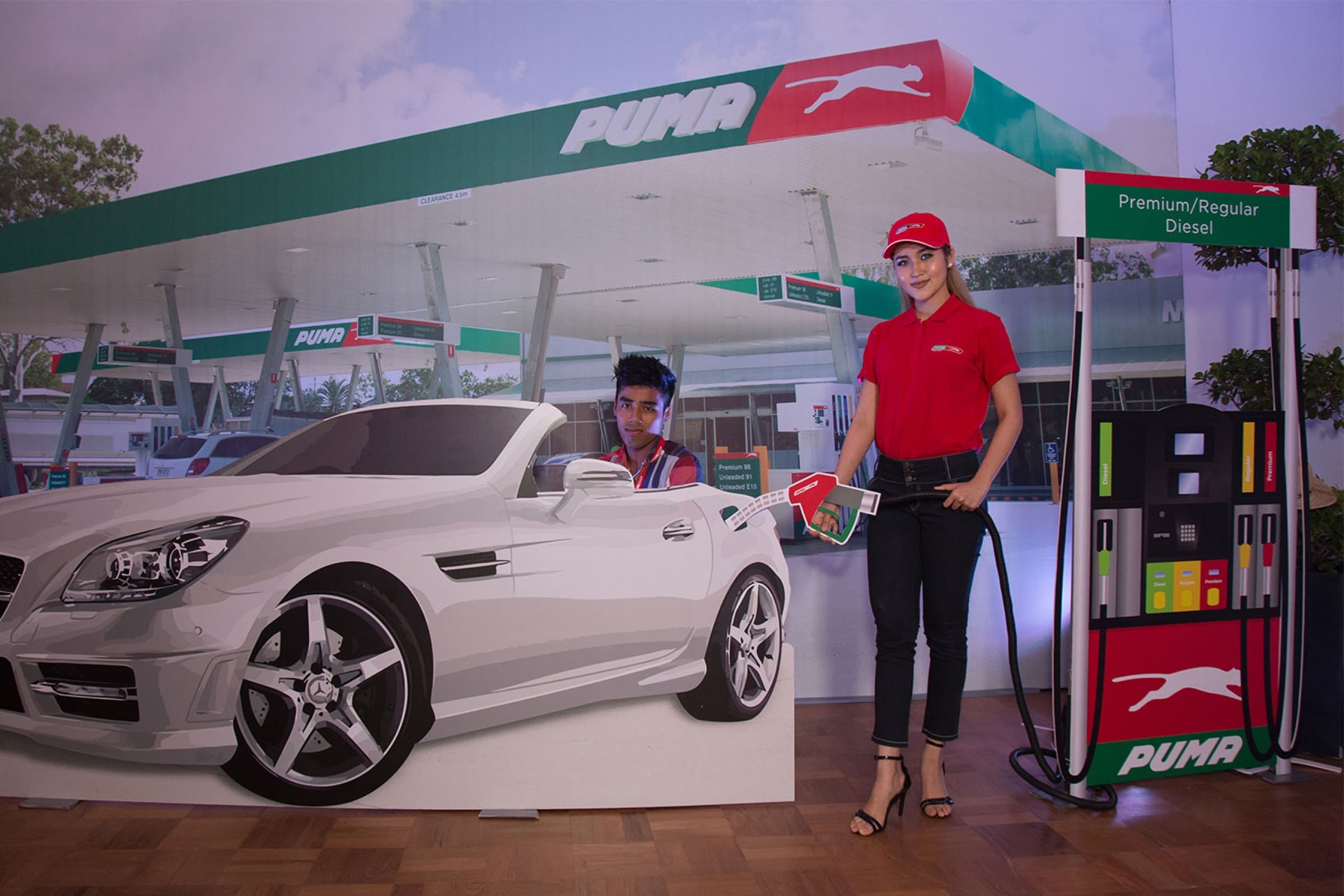 Petrol-station photo booth with cut-out convertible