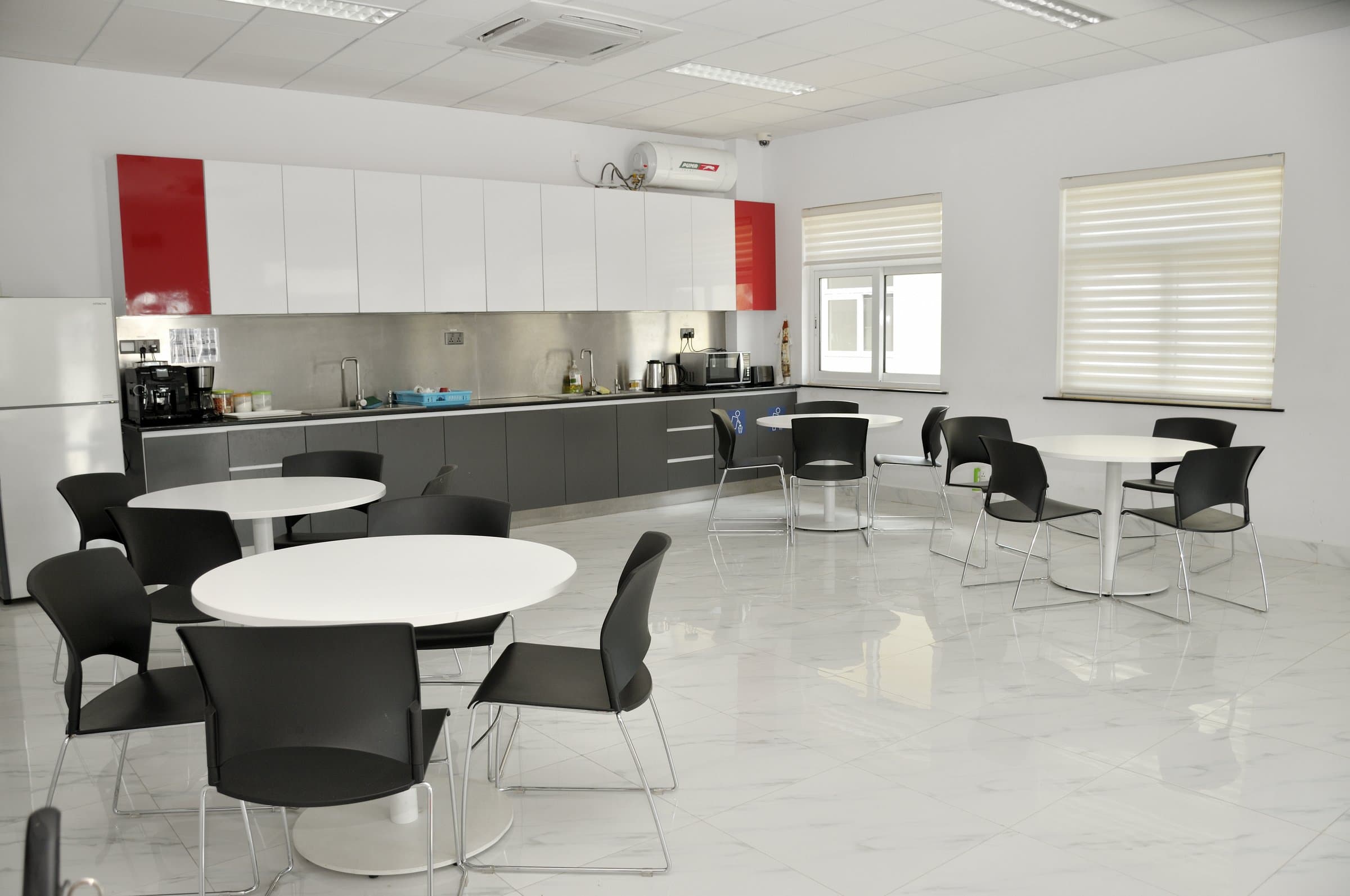 Staff kitchen — the brand carried into the interiors