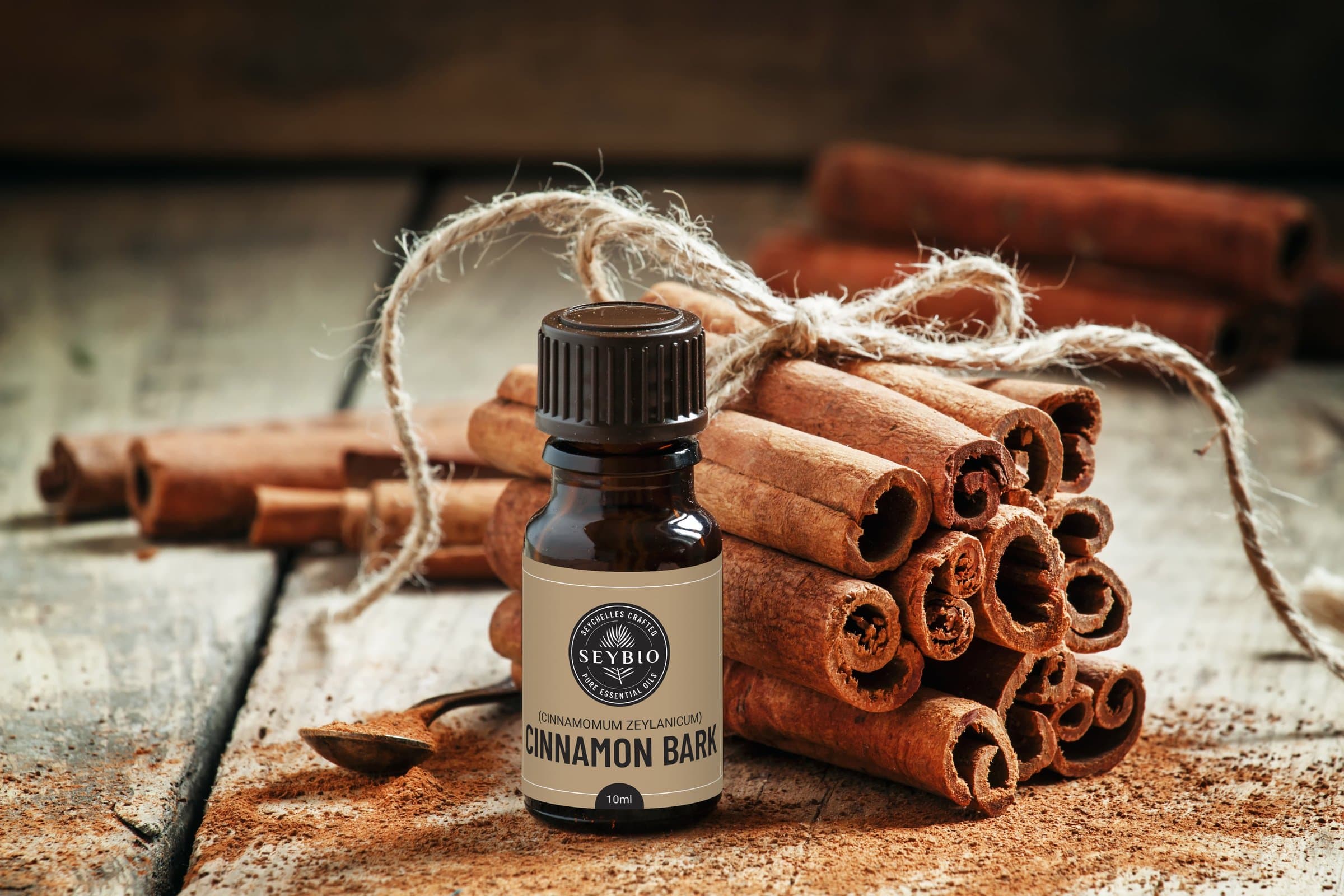 Cinnamon bark oil, staged with the raw spice
